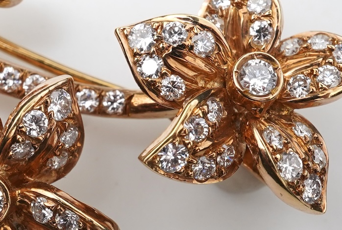 A gold and diamond brooch